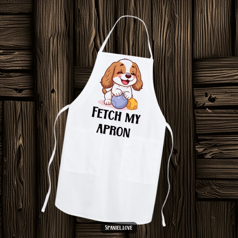 Funny kawaii spaniel barking joyfully and nudging a ball on an apron, a humorous kitchen accessory for dog lovers.