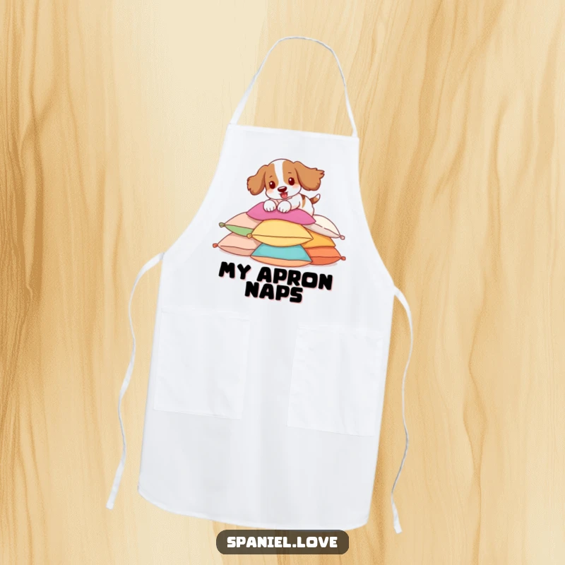 Funny Spaniel Apron featuring a spaniel energetically pouncing on pillows, a humorous kitchen essential.