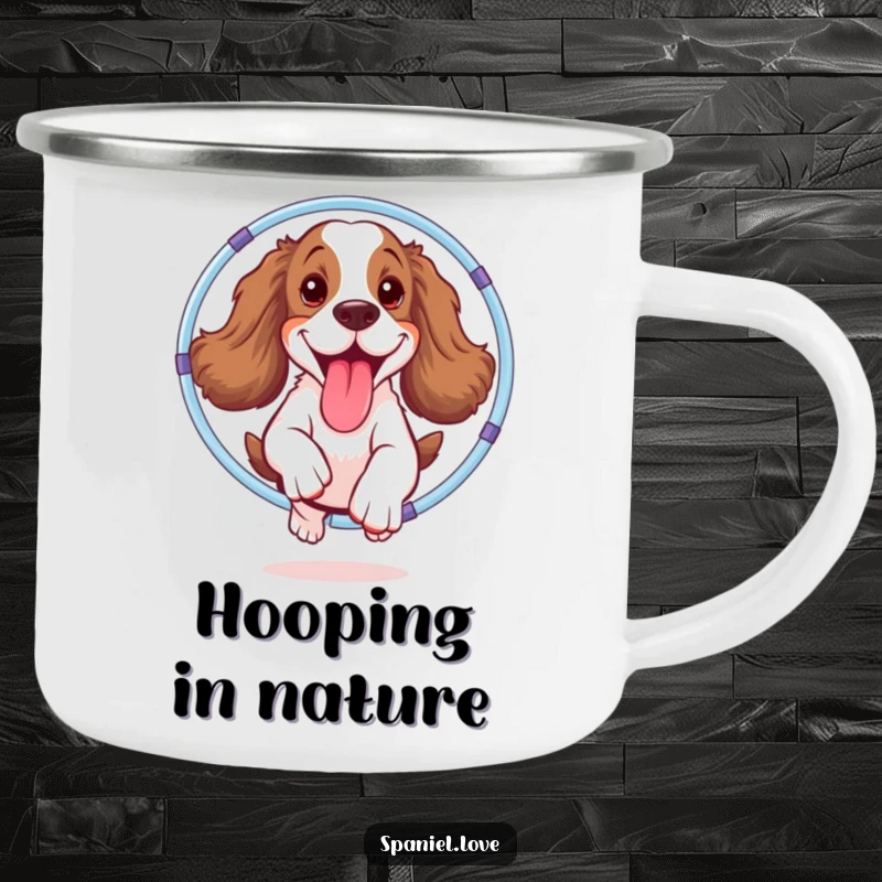Funny spaniel camping mug showing a happy dog jumping through a hula hoop, tongue out, embodying outdoor fun and laughter.