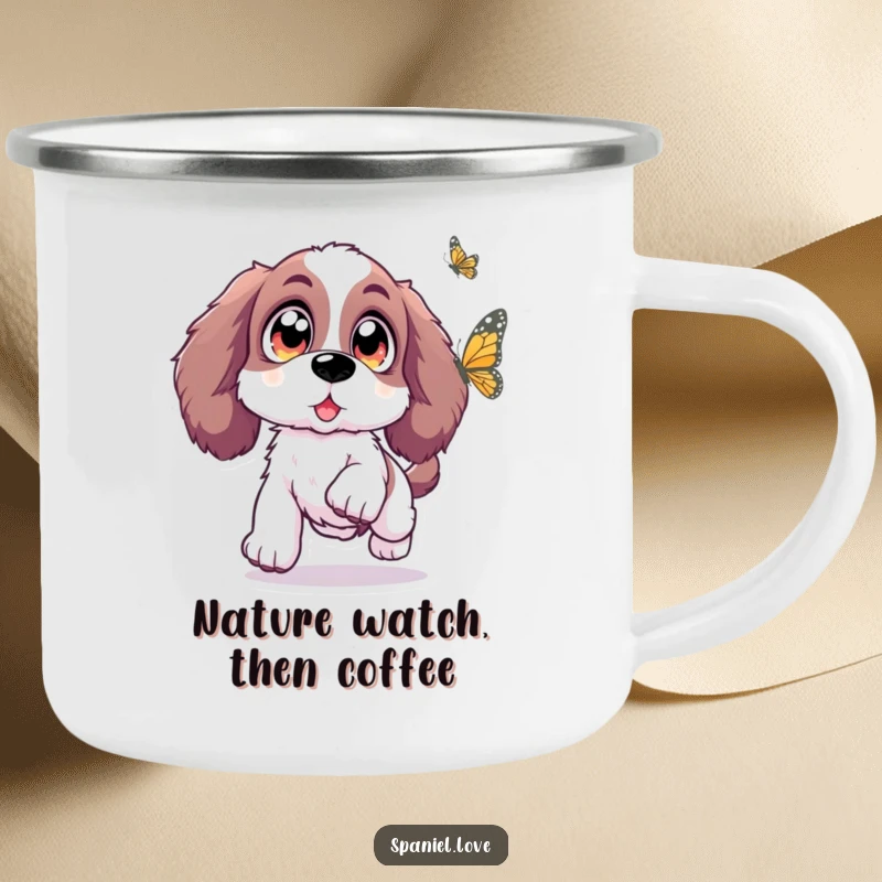 Funny Spaniel camping mug depicting a Spaniel with oversized, sparkling eyes leaping with excitement towards a butterfly, ready for outdoor magic.