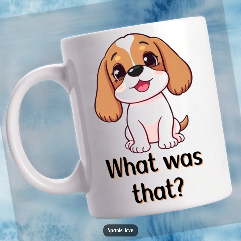 Funny happy spaniel with head tilted, listening intently to an unheard sound on a mug, showing sweet curiosity.
