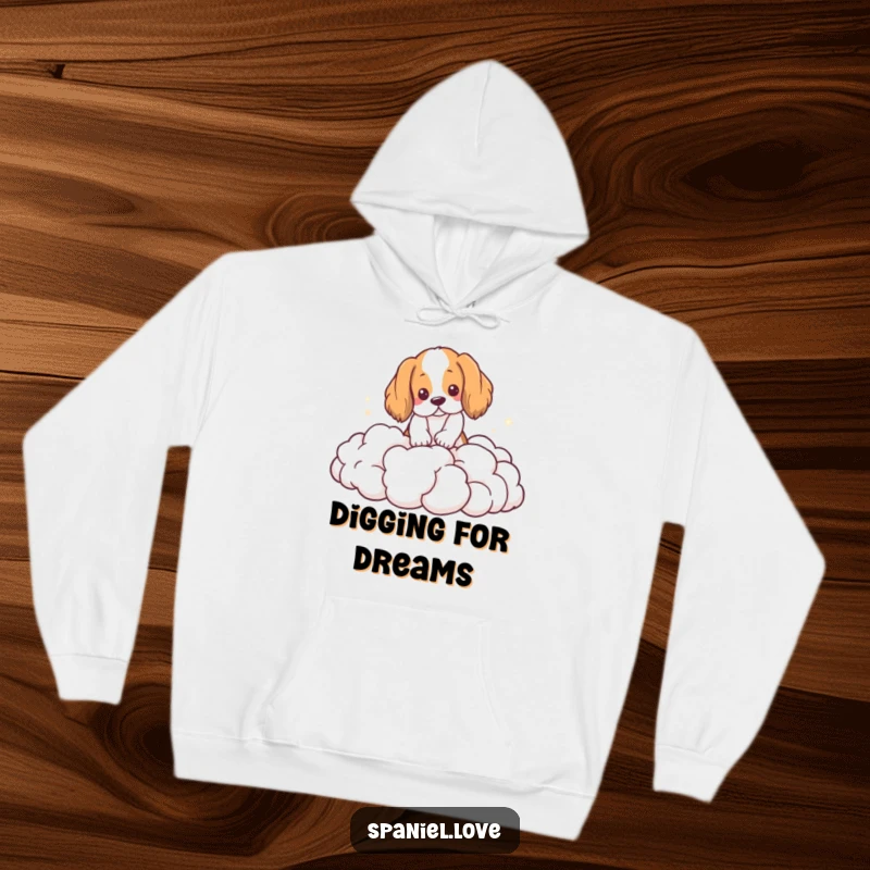 Funny Spaniel Hoodie: A spaniel joyfully digs into a pile of soft, ethereal clouds, looking utterly content.