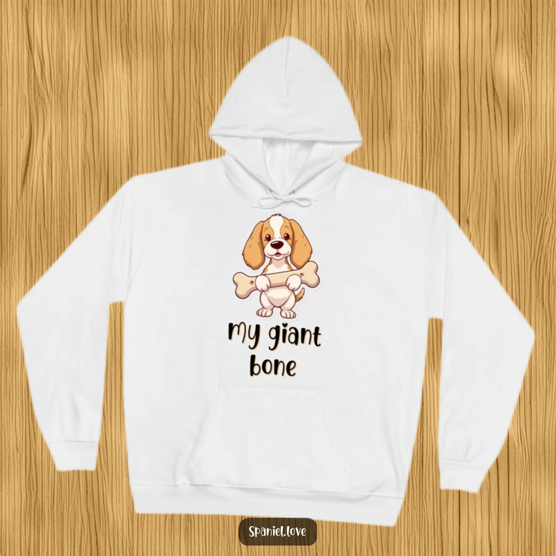 Funny Spaniel Hoodie: A spaniel looks proud while carrying a comically large bone, showcasing its great find.