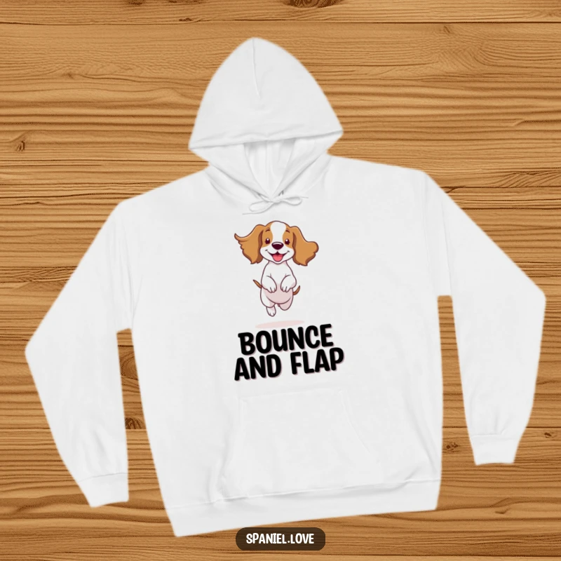 Soft hoodie featuring a funny spaniel character in a happy bounce, ears flapping in the wind, embodying pure joy.