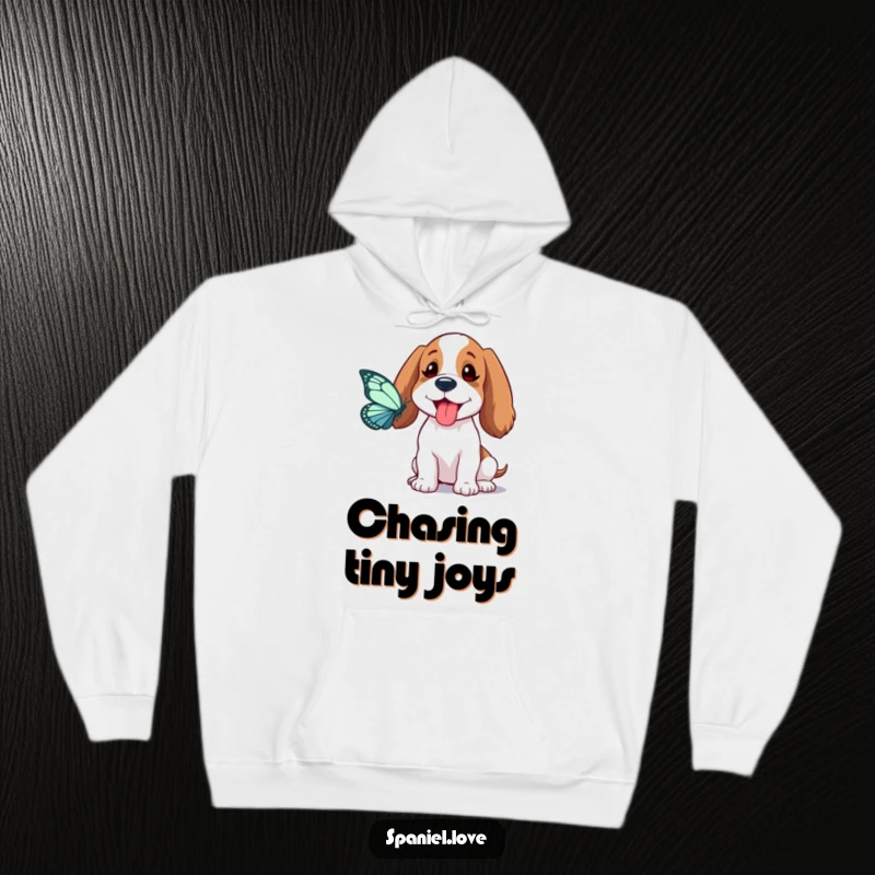 Funny Spaniel Hoodie: A spaniel playfully sticks its tongue out while chasing a butterfly, a design full of goofy charm.