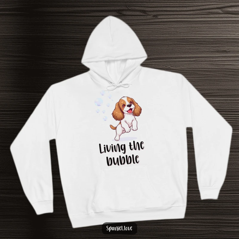 Funny spaniel hoodie showing a happy dog joyfully playing with a stream of bubbles, offering cozy comfort and pure happiness.