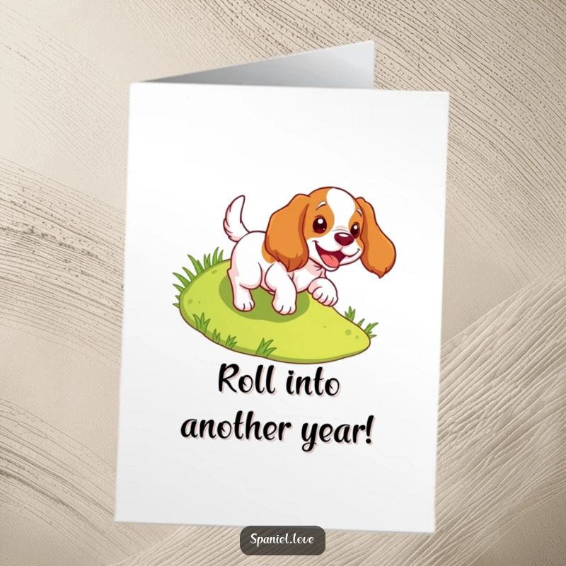 Funny Free Printable Birthday Card: Spaniel joyfully tumbles down a grassy slope. Energetic and happy dog.