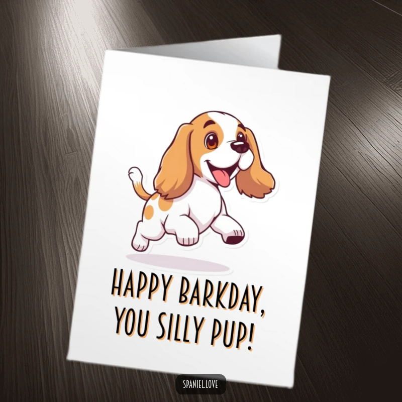 Funny Free Printable Birthday Card: A happy spaniel with floppy ears is joyfully chasing its own wagging tail in circles.