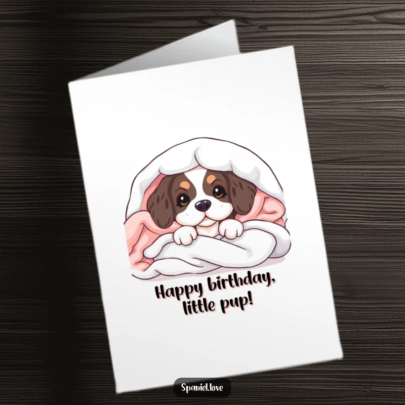 Cute Free Printable Birthday Card: A spaniel puppy peeks out from a cozy pile of soft blankets.