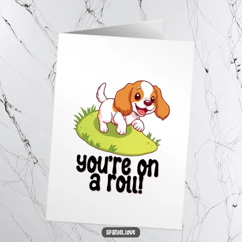 Funny Free Printable Congratulations Card: Spaniel gleefully tumbles down a gentle grassy hill. Playful dog.