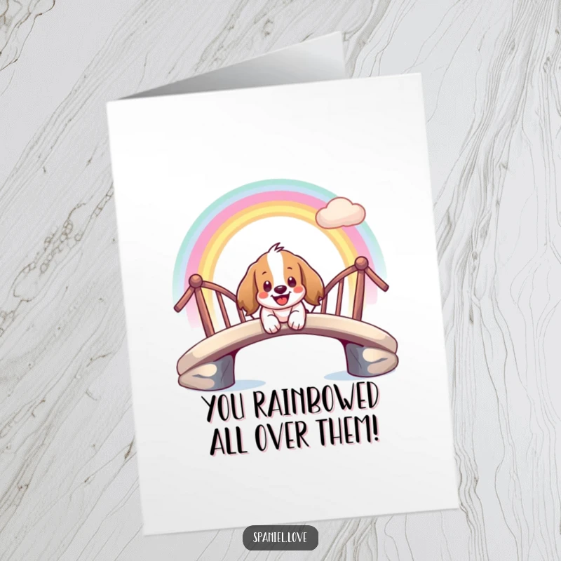Funny Free Printable Congratulations Card: A giddy spaniel smiles while sliding down a rainbow bridge, a joyful downloadable art.