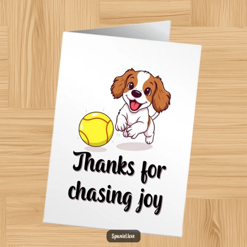Funny free printable thank you card: Spaniel puppy with floppy ears flying, chasing a large tennis ball with pure excitement.