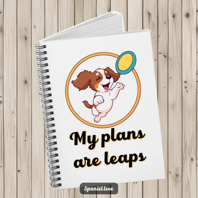 Funny Spaniel Notebook: A spaniel leaps through a hoop catching a frisbee, ready to capture your dynamic ideas.