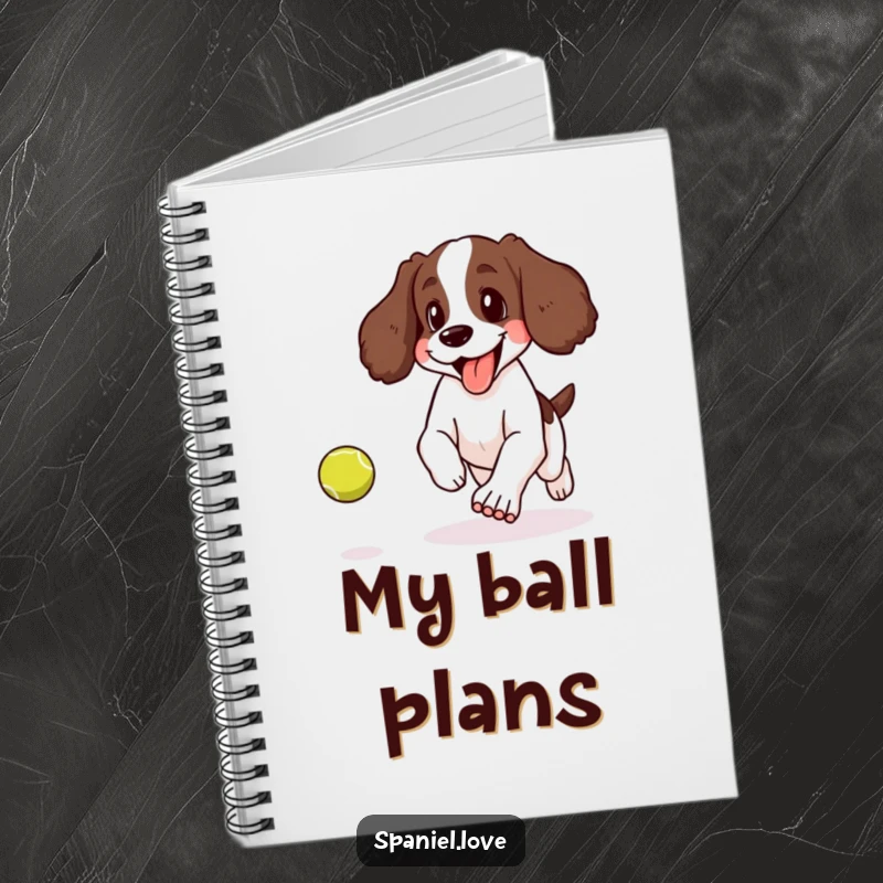 Funny notebook with a spaniel panting happily with its tongue lolling out while chasing a bouncing tennis ball.
