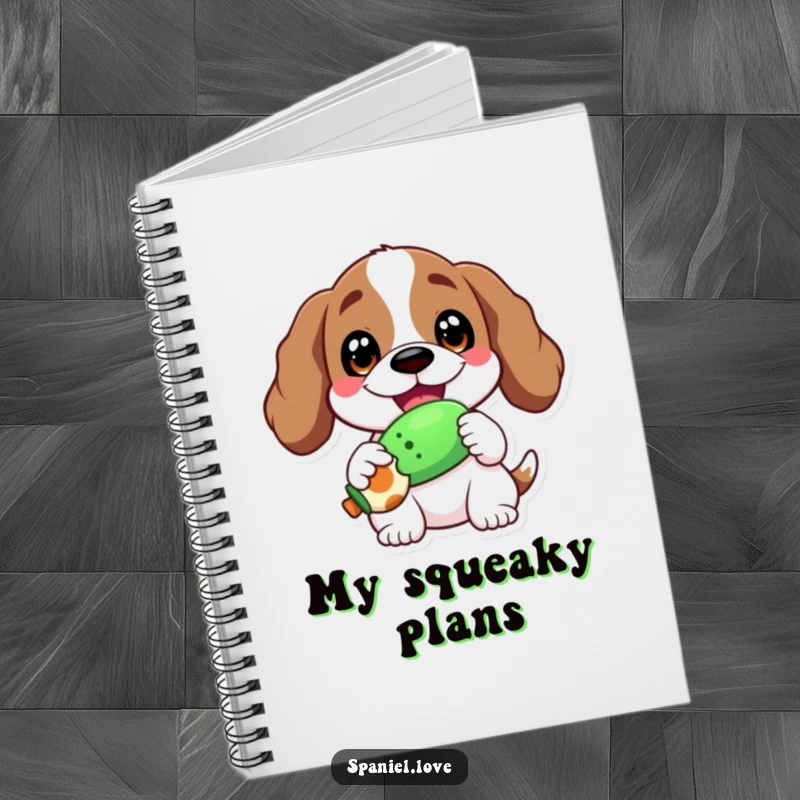 Funny notebook with a spaniel character with a wide, happy grin, holding a squeaky toy.