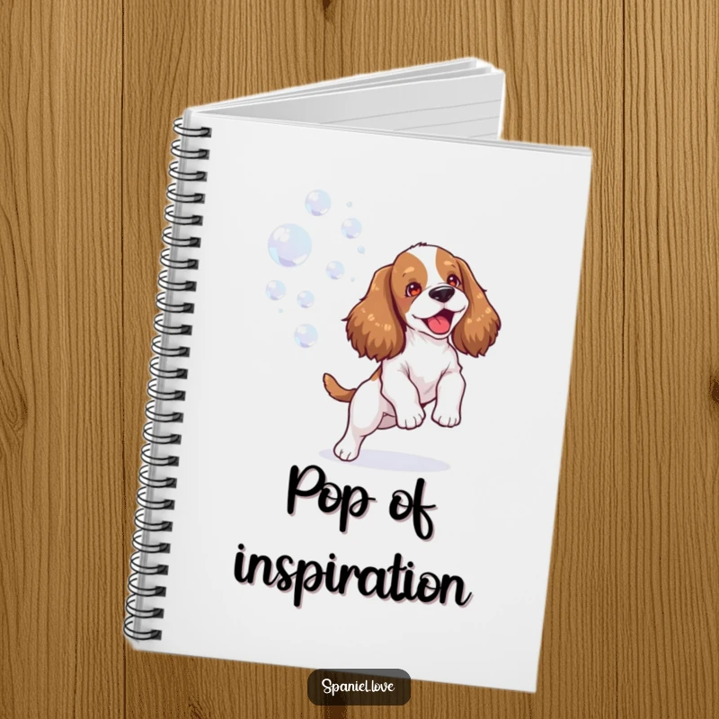 Funny spaniel notebook depicting a happy dog joyfully playing with bubbles, perfect for jotting down cheerful thoughts and ideas.