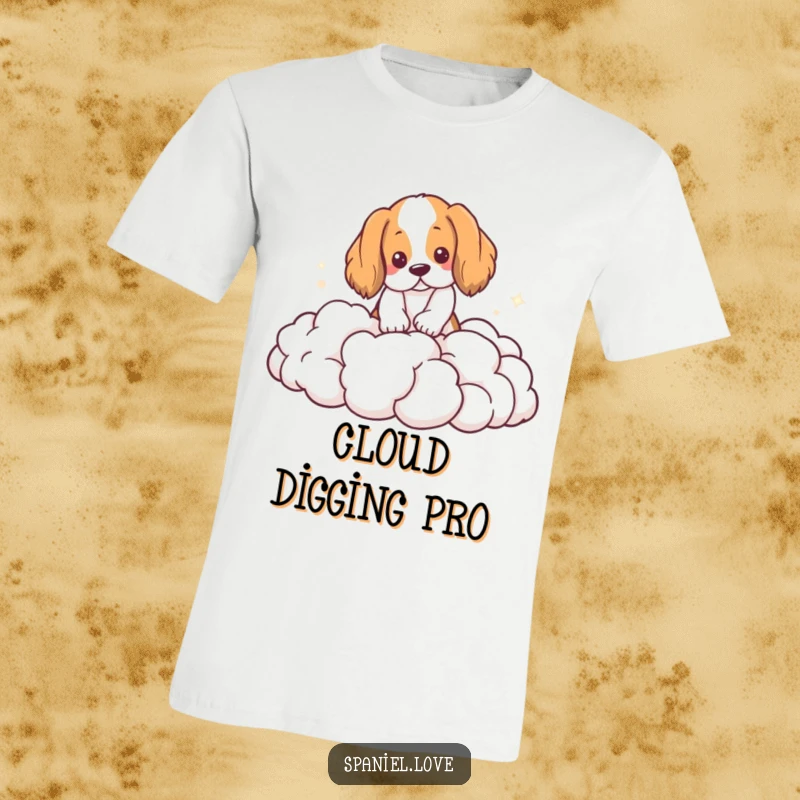 Funny Spaniel T-Shirt: A spaniel is energetically digging with its paws into a heap of fluffy, white clouds.