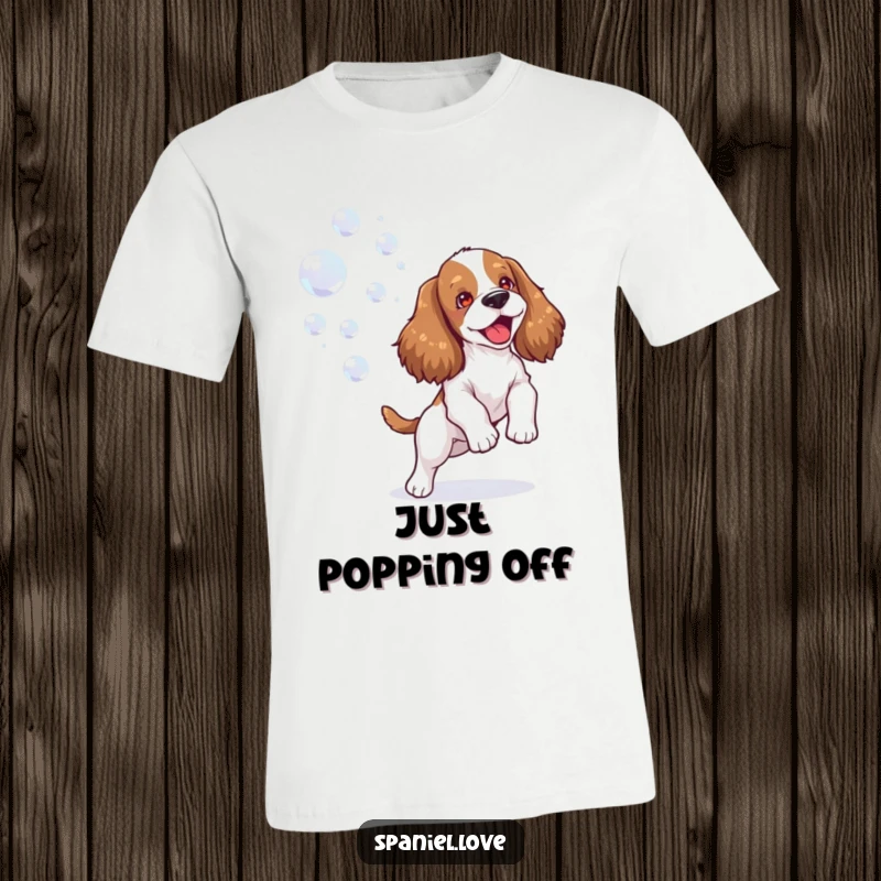 Funny spaniel t-shirt featuring an ecstatic dog joyfully playing with a stream of floating bubbles, embodying pure, carefree fun.