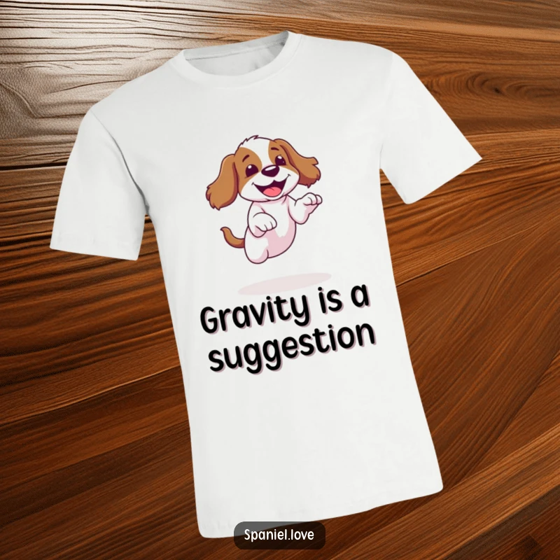 Funny spaniel t-shirt showing a dog attempting a jump and landing with a giggle, great for humor lovers.