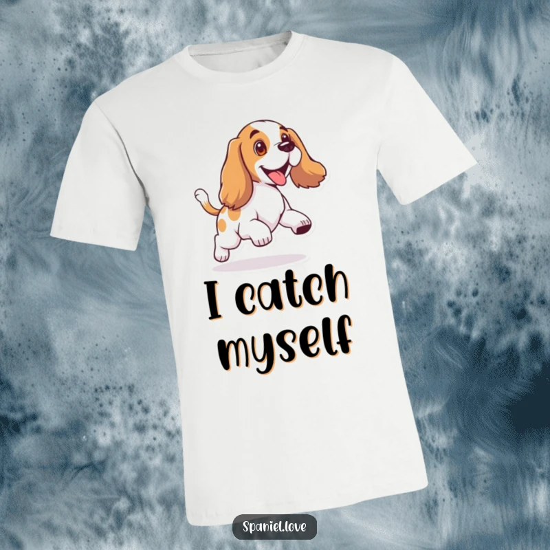 Funny t-shirt featuring a spaniel with floppy ears, joyfully and comically chasing its wagging tail in a circle.