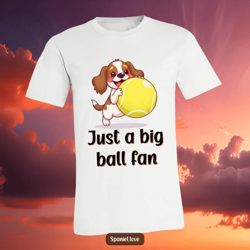 Funny spaniel t-shirt, a happy dog joyfully interacting with a huge tennis ball, showcasing pure, unadulterated fun.
