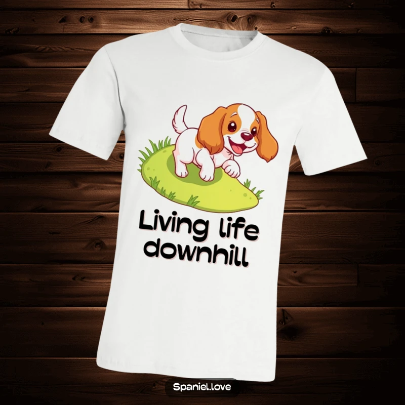 Funny spaniel t-shirt showing a dog joyfully tumbling down a grassy slope, celebrating freedom and happiness.