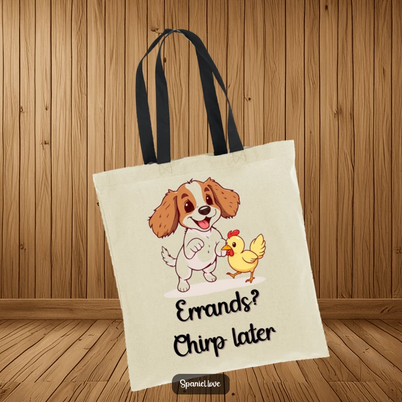 Funny Spaniel Rubber Chicken Pounce Tote Bag: A spaniel dog playfully leaps to catch a brightly colored rubber chicken mid-air.