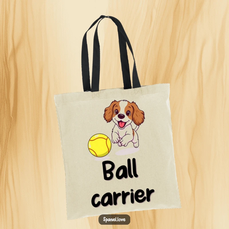 Funny spaniel puppy excitedly chasing a giant tennis ball, printed on a durable tote bag for everyday use.