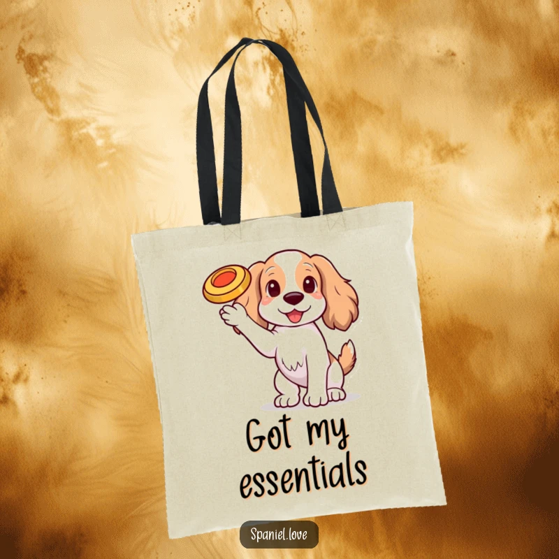 Funny Spaniel dog with one paw raised, balancing a tiny, spinning frisbee on its nose on a tote bag, a perfect accessory.