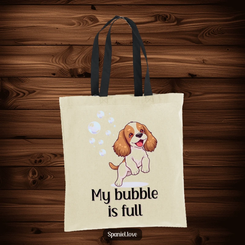 Funny spaniel tote bag depicting a happy dog joyfully playing with bubbles, perfect for carrying your items with bubbly flair.